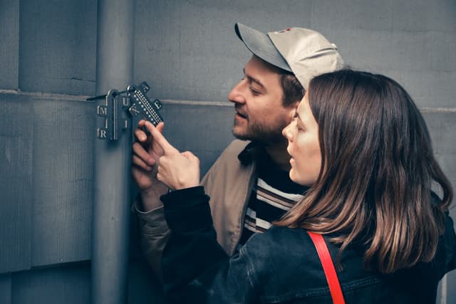 Friends playing an outdoor escape game in Frauenfeld